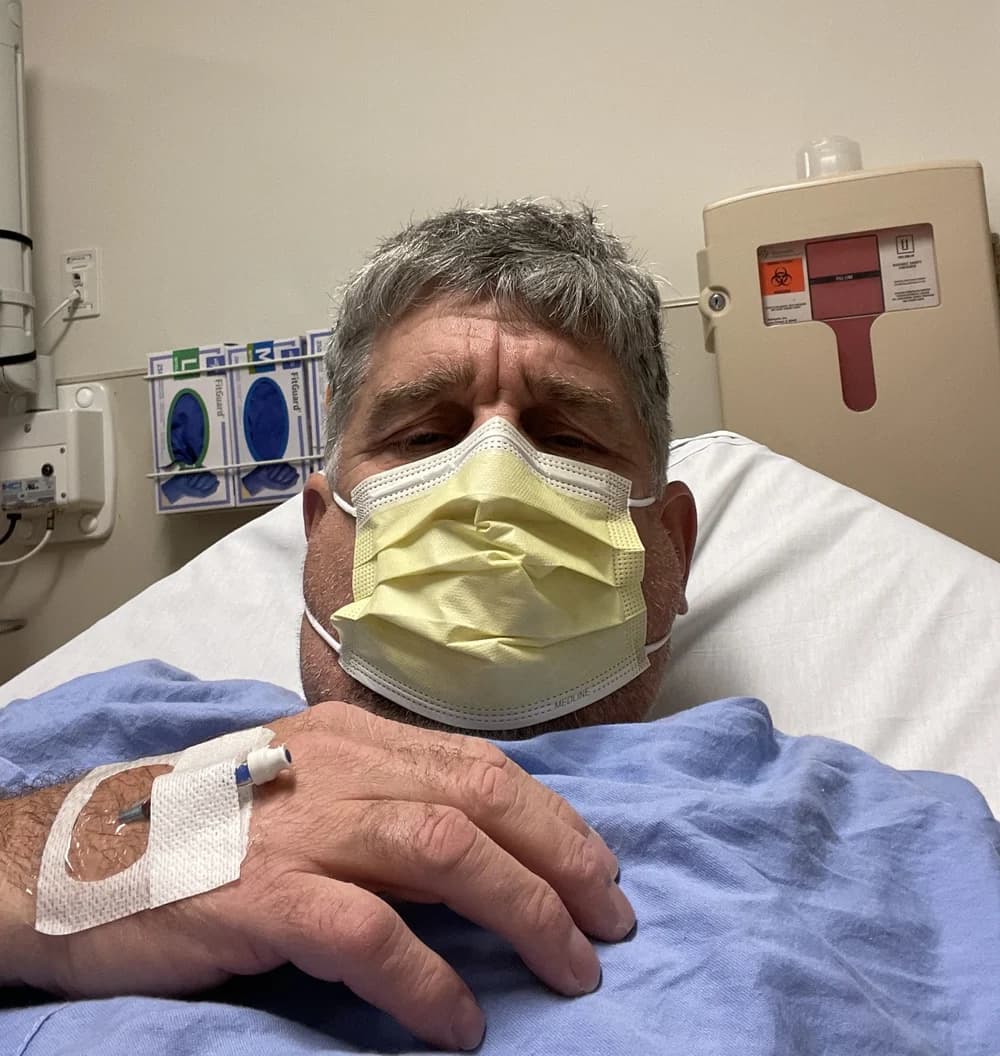 Paul Kearney in a hospital bed during his cancer treatment